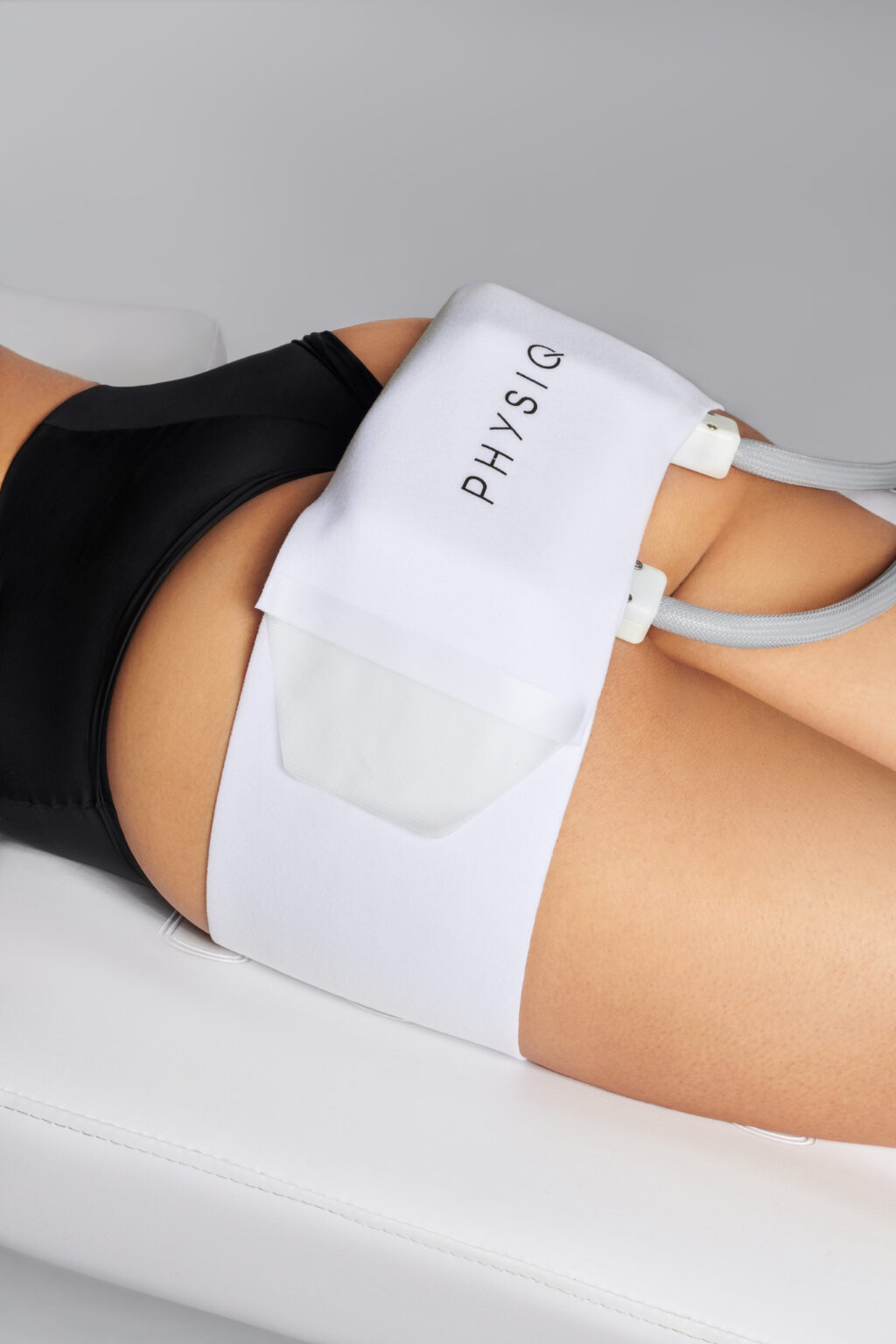 PHYSIQ applicators positioned on the abdomen